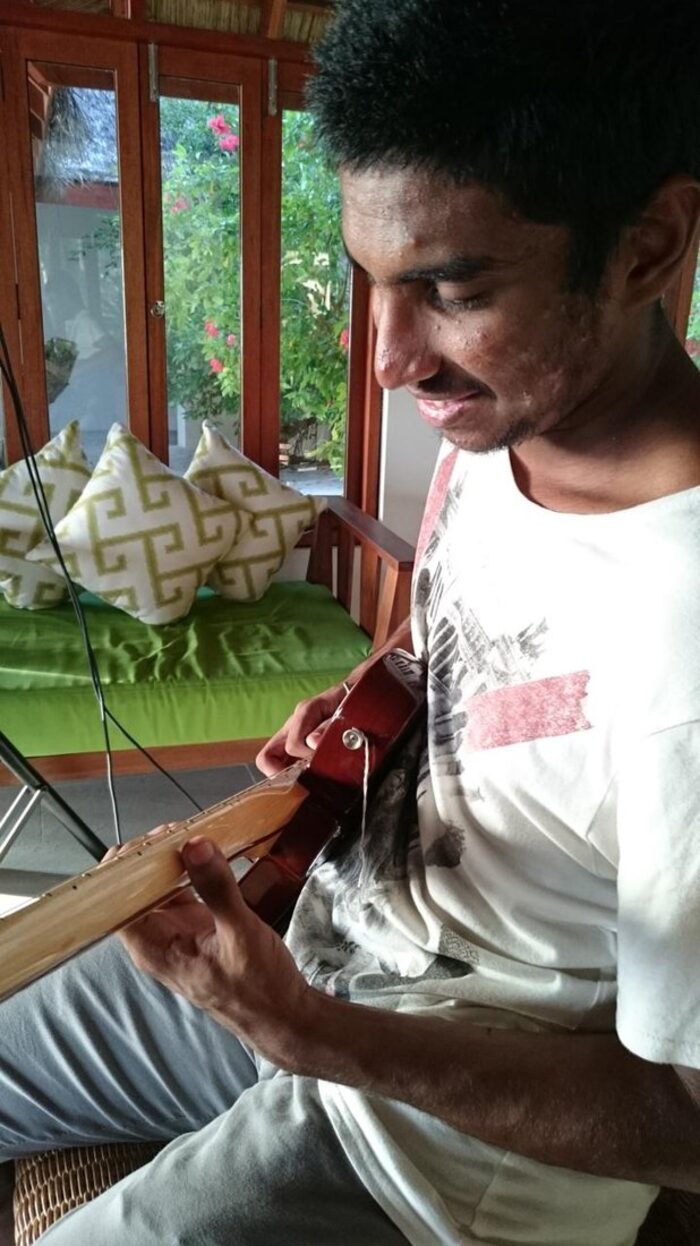 On a veranda with a guitar
